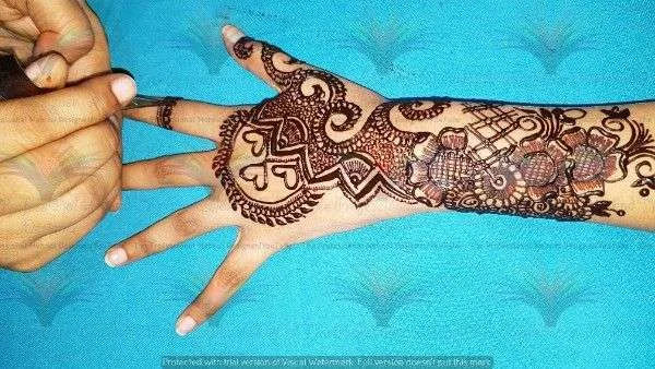50 Best Backhand Mehndi Design Pictures and Videos 35 Back side mehndi desing of cone