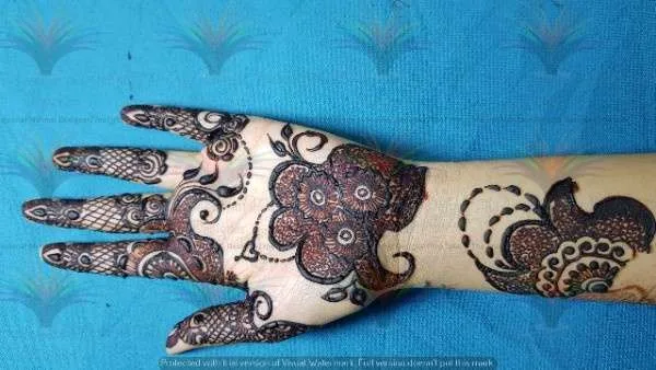 a hand with henna on it