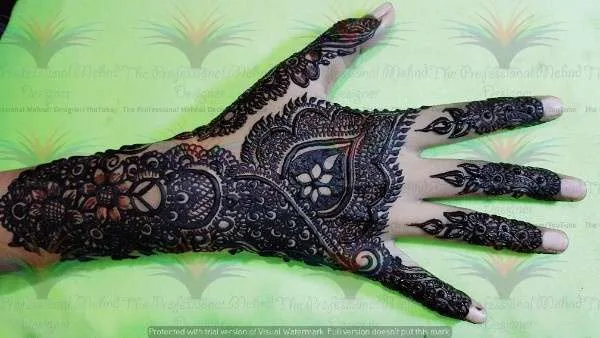 50 Best Backhand Mehndi Design Pictures and Videos 33 back side cone mehndi design photo