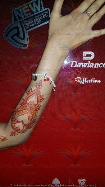 fridege and hand with mehndi design