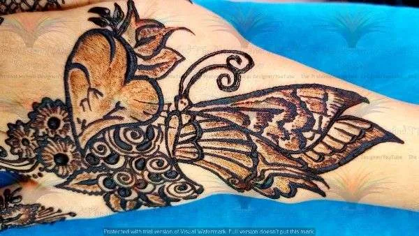 mehndi design of butterfly 🦋 with cone on hand