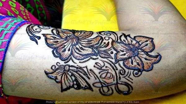 flower and butterfly on shoulder with cone mehndi