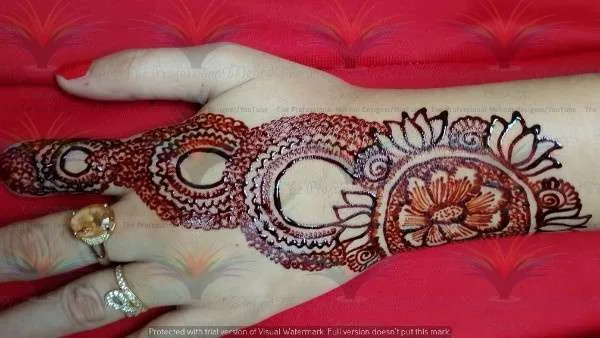 50 Best Backhand Mehndi Design Pictures and Videos 23 Back Hand Side Mehndi Design Red Cone