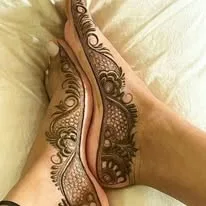 female showing best mehndi design on foot