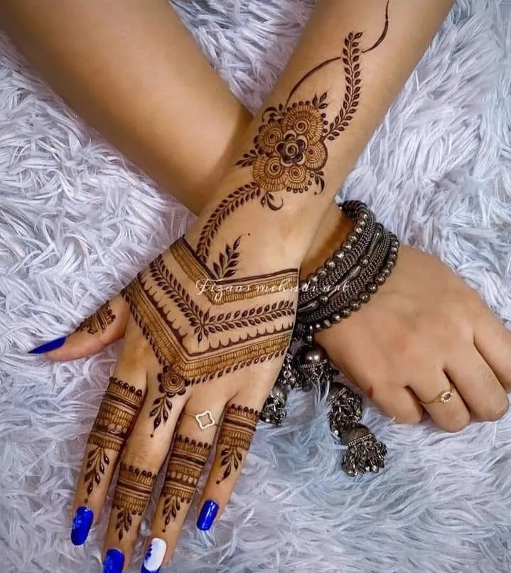 250+ Best Mehndi Designs for Hand Picture and Videos 98 back side mehndi show off on white surface