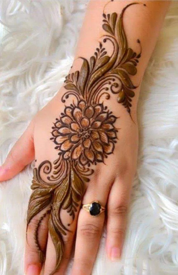250+ Best Mehndi Designs for Hand Picture and Videos 90 beautiul flower mehhdi designs on back hand side placing hand on white cloth