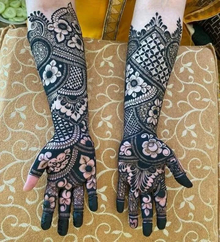250+ Best Mehndi Designs for Hand Picture and Videos 78 female shoing hand applied mehndi on it