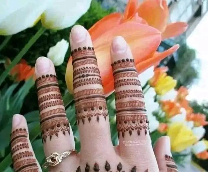 250+ Best Mehndi Designs for Hand Picture and Videos 72 finger mehndi desing flower on background