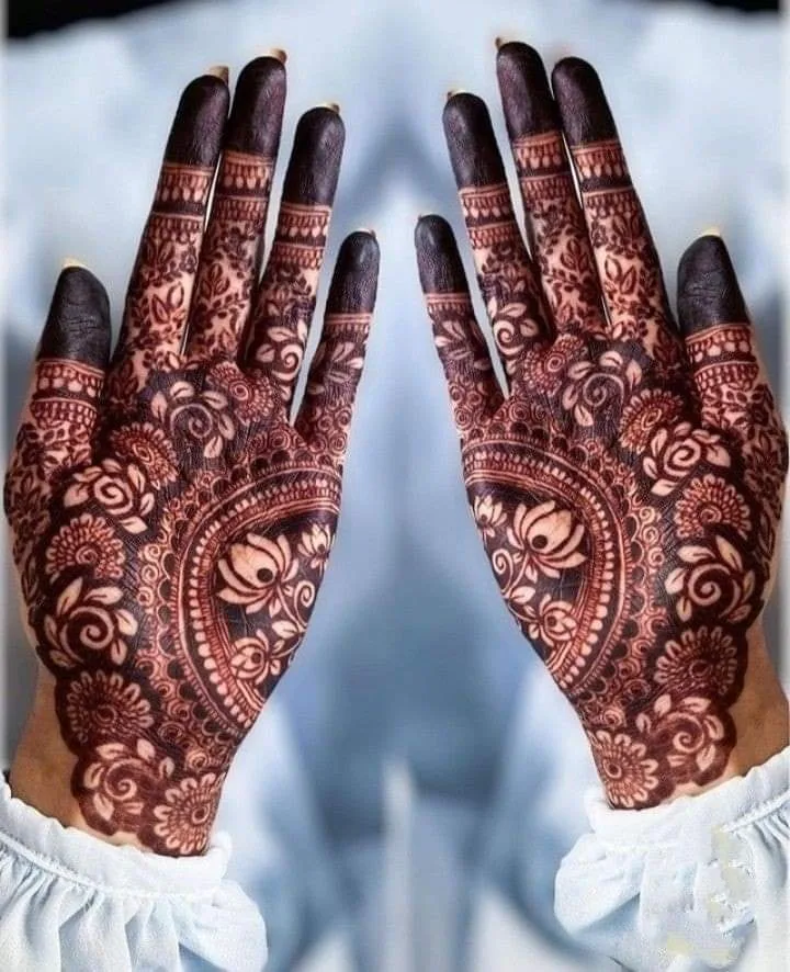 250+ Best Mehndi Designs for Hand Picture and Videos 64 front hand mehndi wearing sky colour dress
