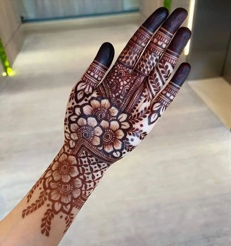 250+ Best Mehndi Designs for Hand Picture and Videos 48 girl showig his hand applied full hand mehndi desig n on palm