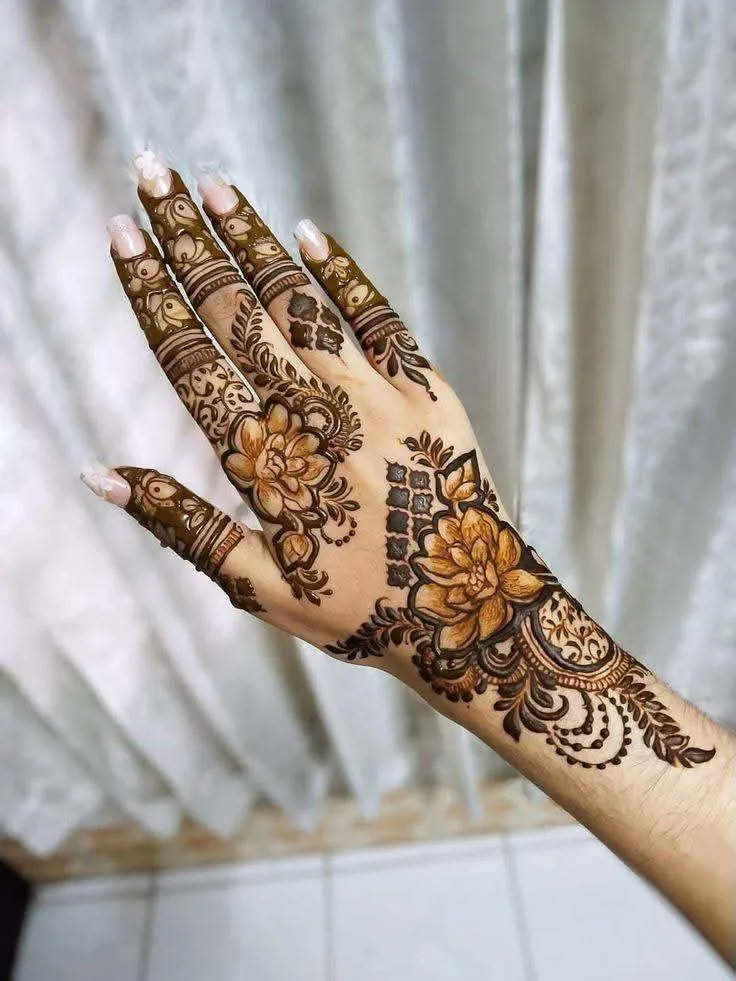 250+ Best Mehndi Designs for Hand Picture and Videos 16 show back side of hand applied with mehndi with white curtain on back side