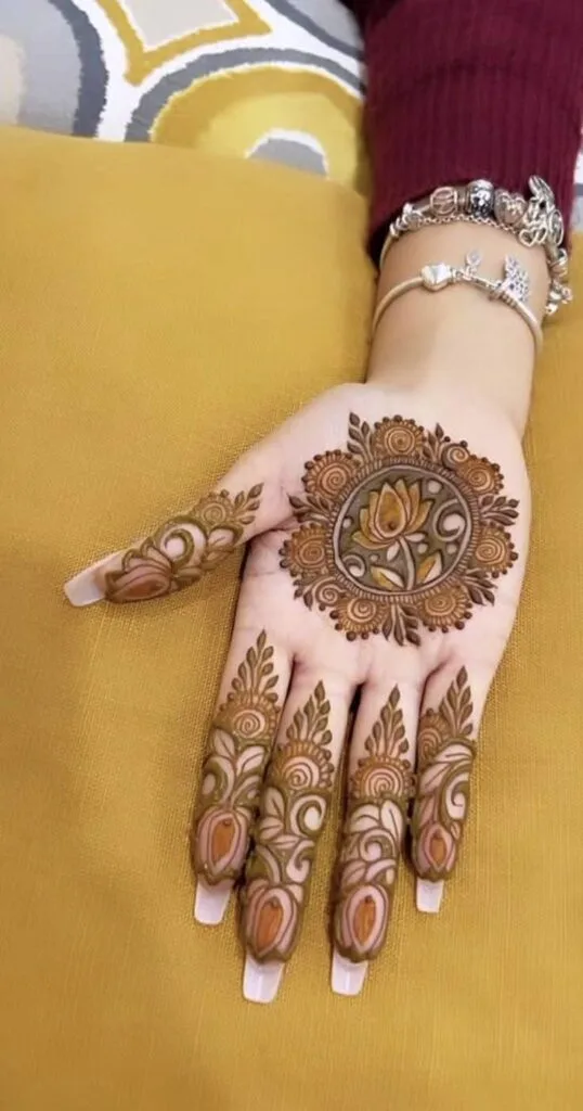 250+ Best Mehndi Designs for Hand Picture and Videos 15 show of palm mehndi wearing red shirt
