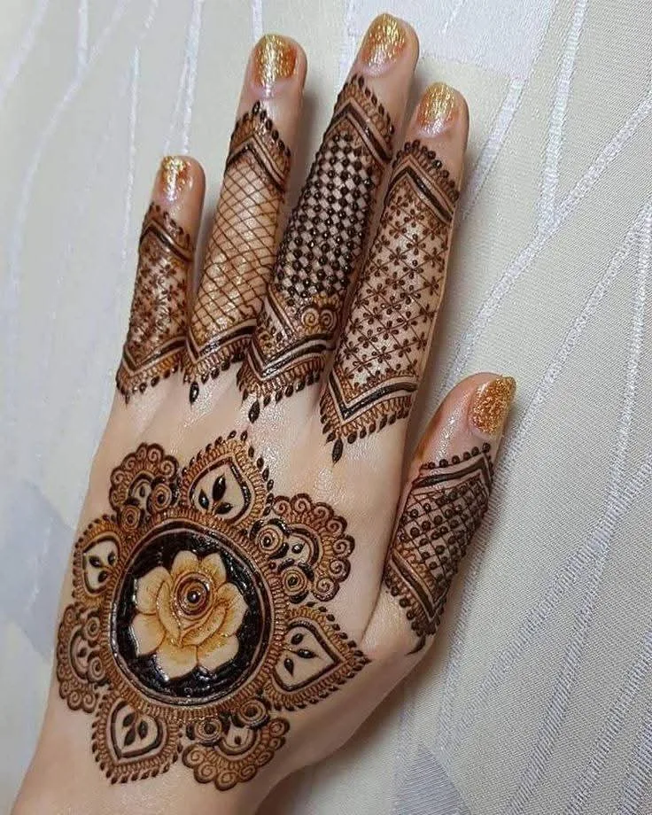 250+ Best Mehndi Designs for Hand Picture and Videos 2 tikki style back hand mehndi placing hand on wall
